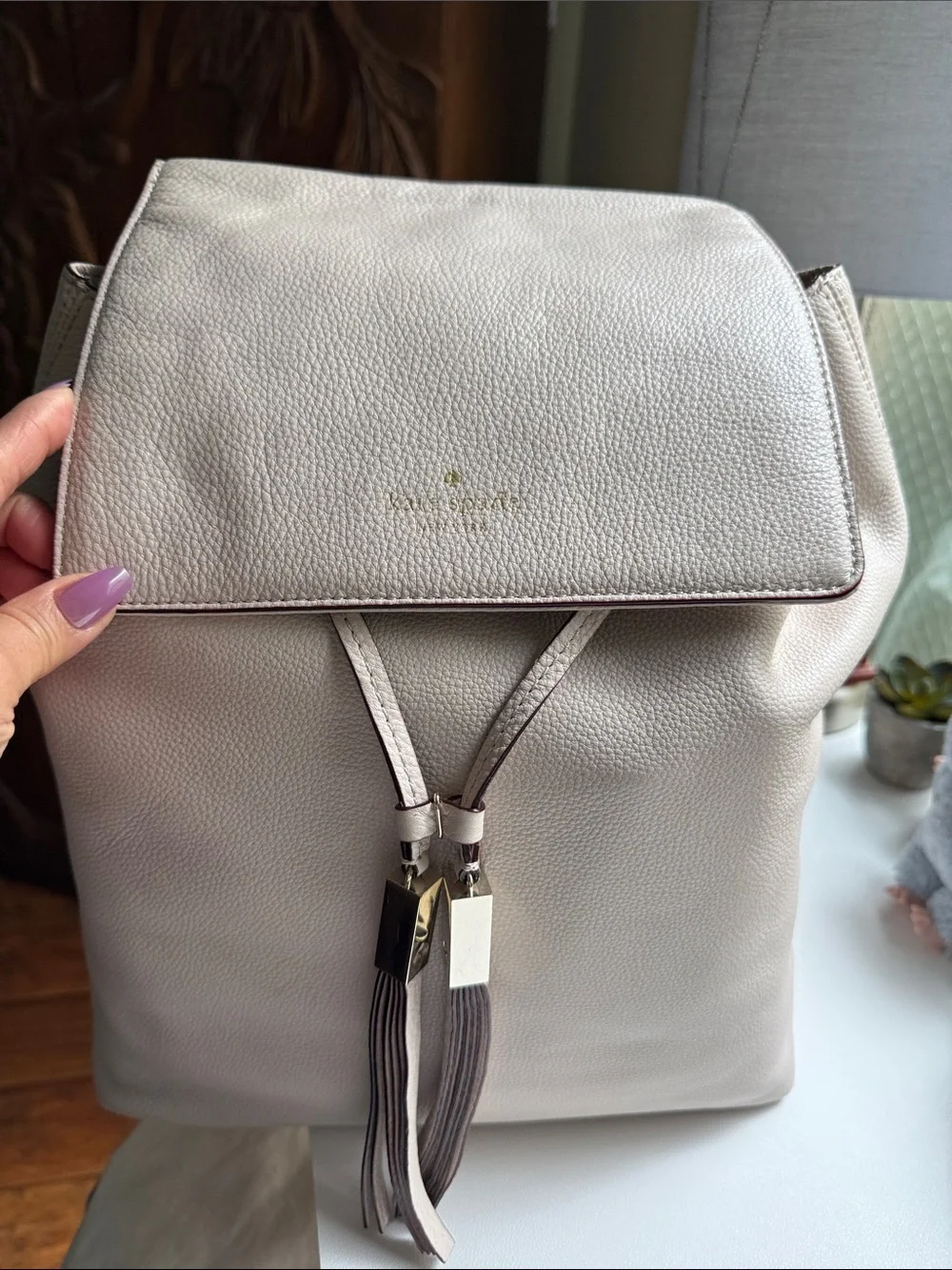 kate spade Pebbled Cream Leather Backpack with Tassel Accents